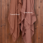 Color comparison of two brown hijabs draped over a wooden surface with color swatches labeled 'Toasted Pecan' and 'Fawn Brown'.