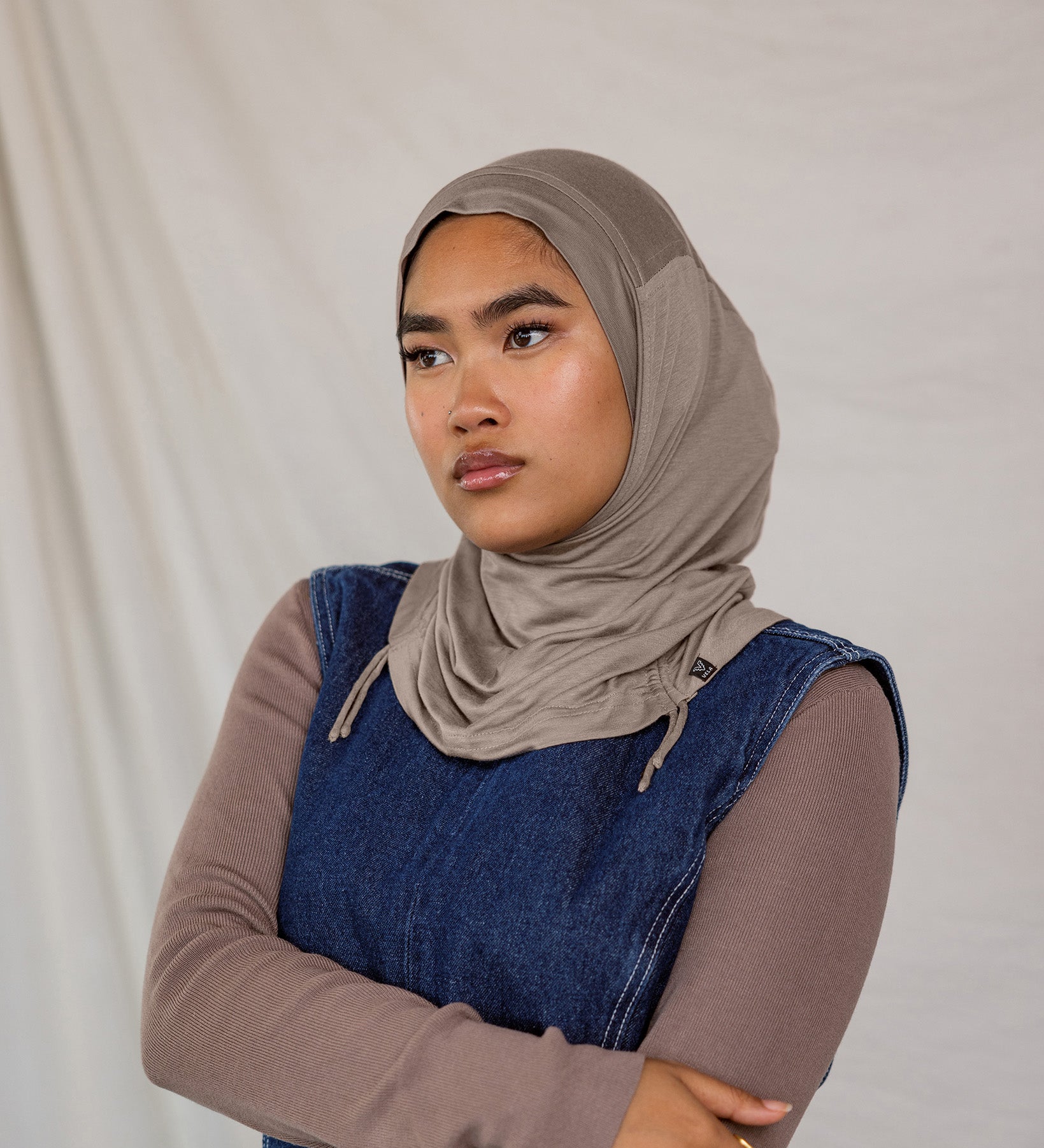 Model wearing Truffle Mink Ruching Lite, showing taupe-grey tone and texture.