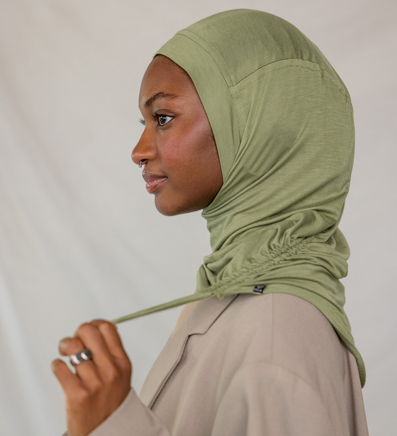 Model wearing Palm Desert Ruching Lite, showing ruching texture and breathable, wrinkle-free fabric.