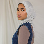 Model wearing Marble Grey Ruching Lite, highlighting the modern grey tone from front facing angle.