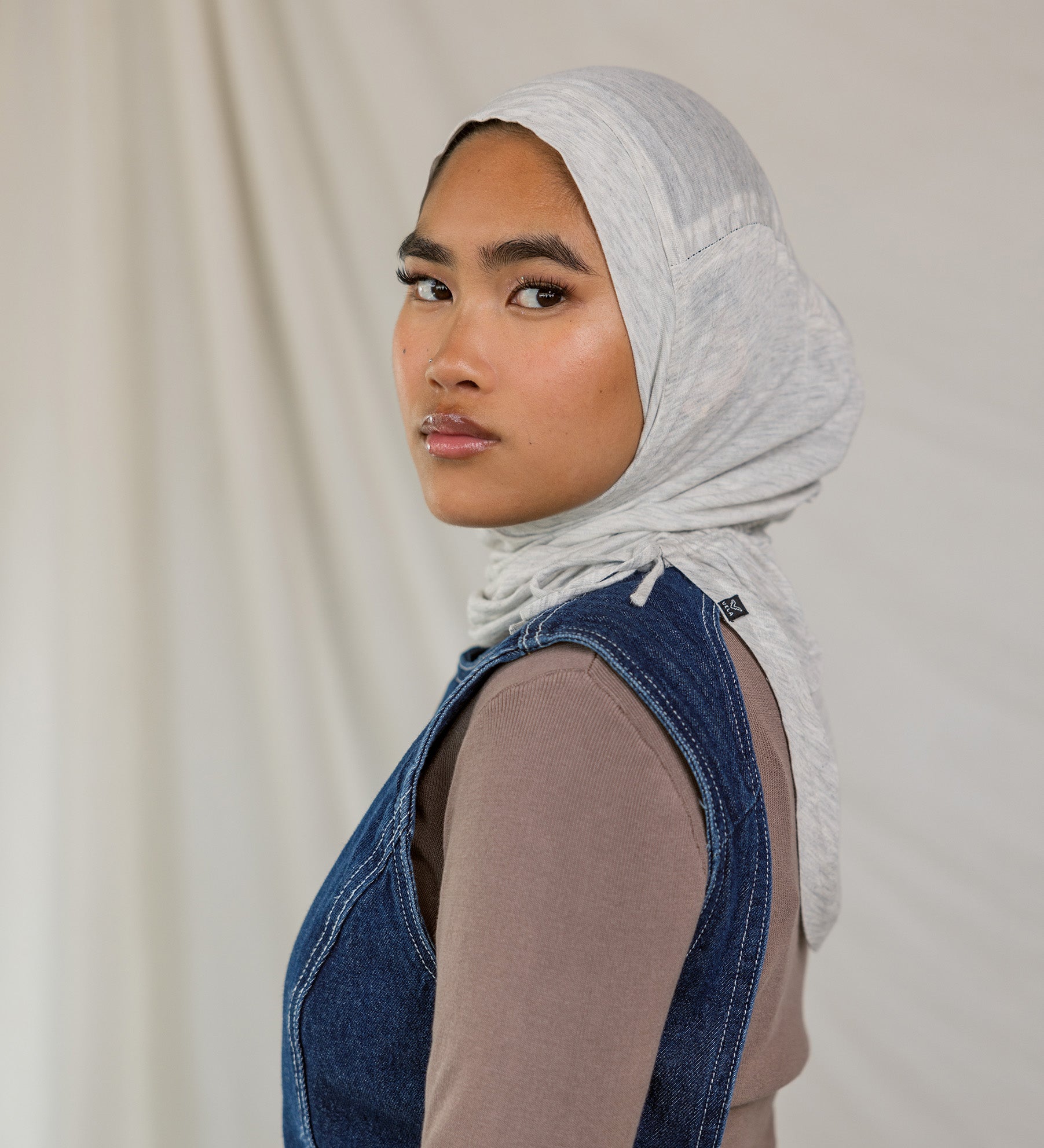 Model wearing Marble Grey Ruching Lite, highlighting the modern grey tone from front facing angle.