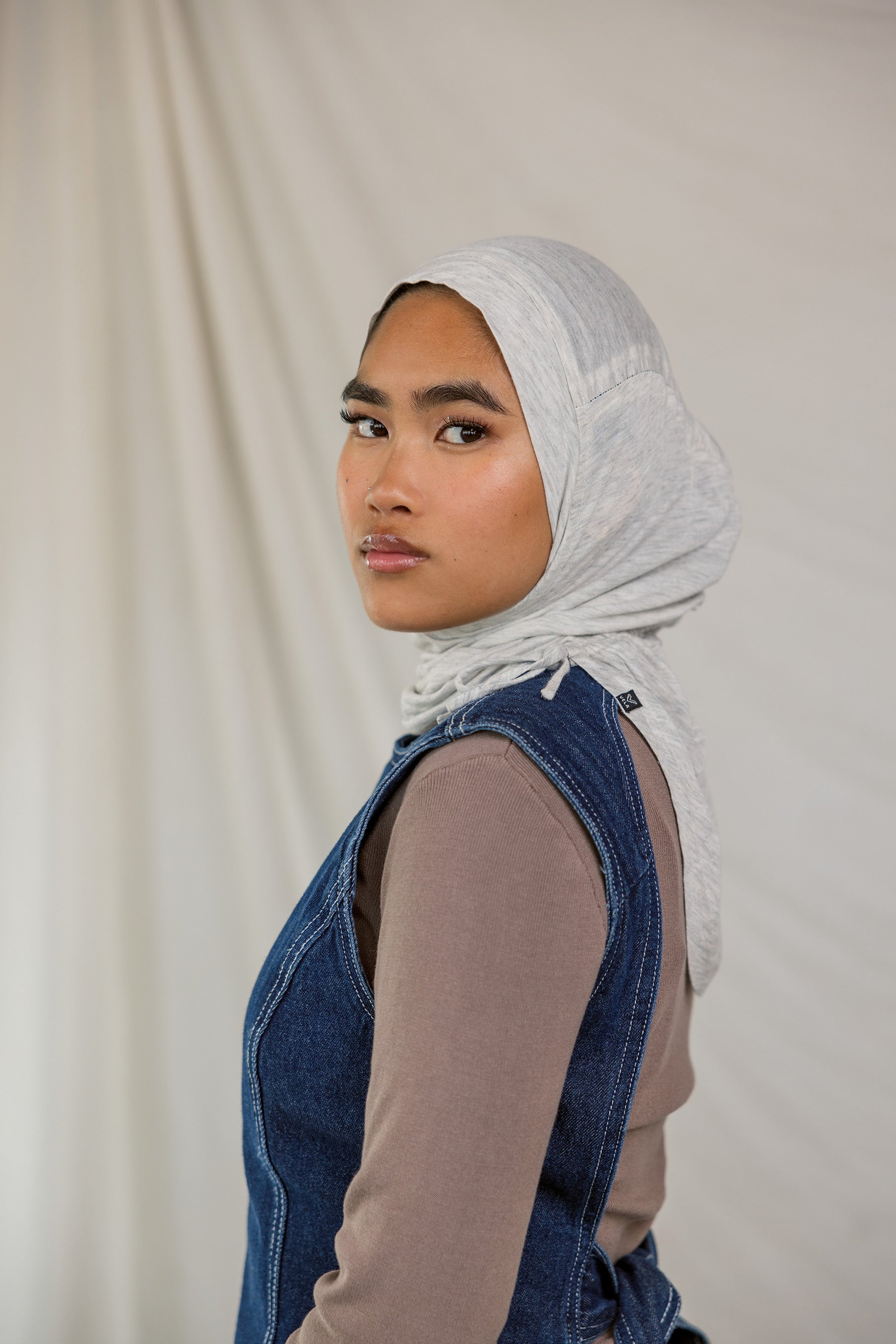 Model wearing Marble Grey Ruching Lite, highlighting the modern grey tone from front facing angle.