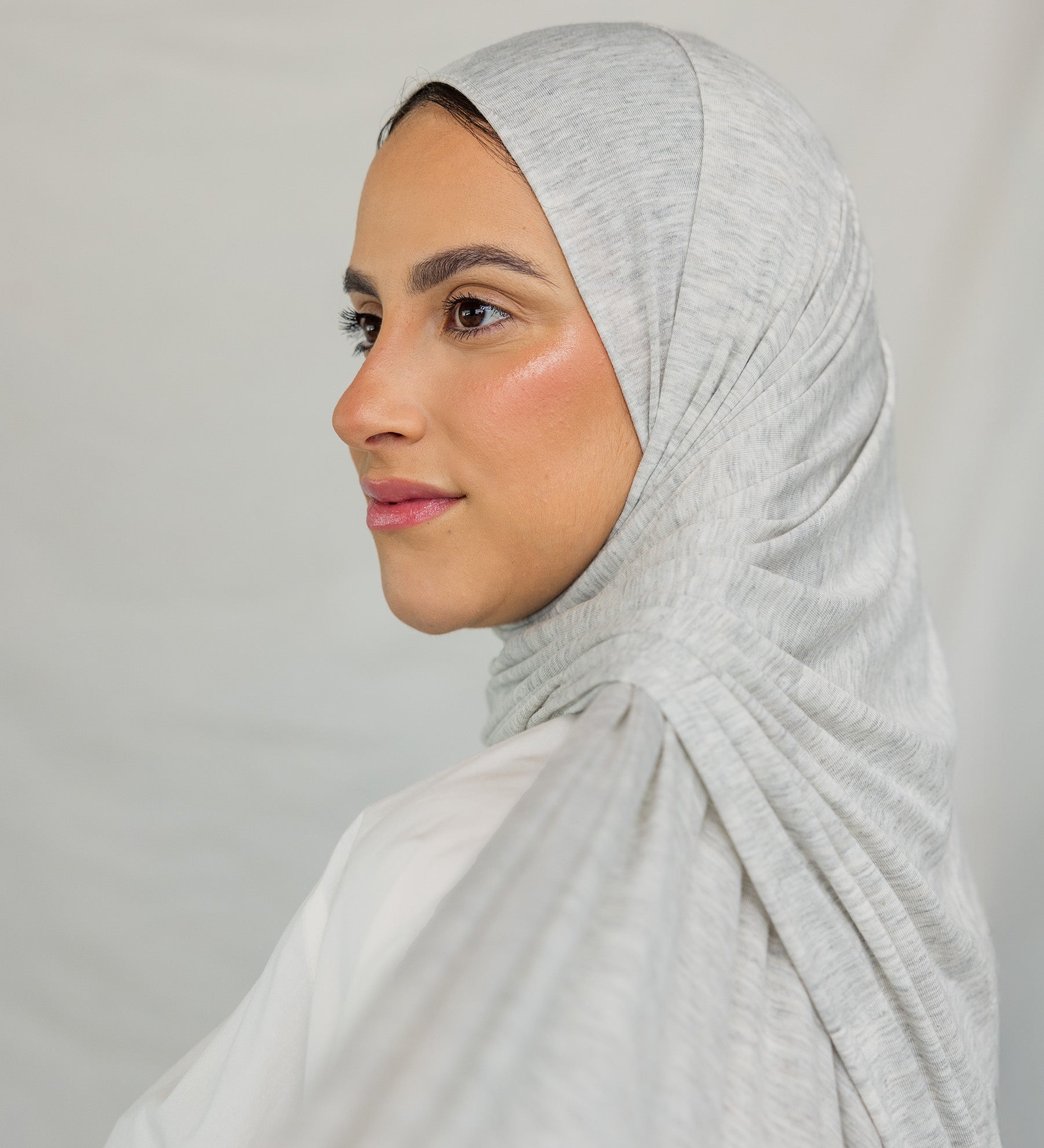 Close-up image of model wearing Marble Grey Jersey Lite draped neatly.