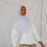 Model wearing Soft Amethyst Jersey Lite wrapped neatly, displaying its wrinkle-resistant, featherlight drape.