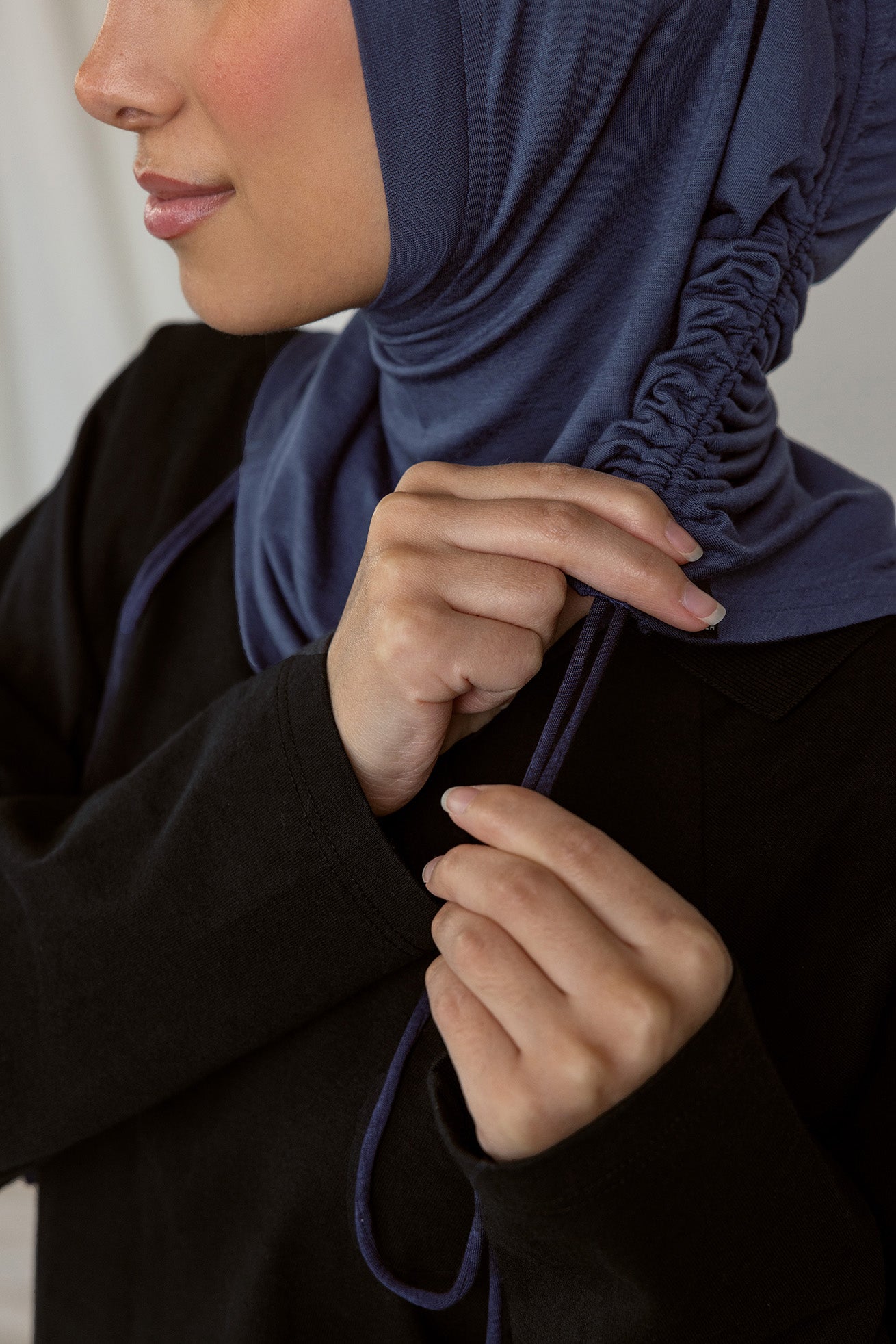 Image depicts model ruching her Twilight Blue Ruching Lite hijab.