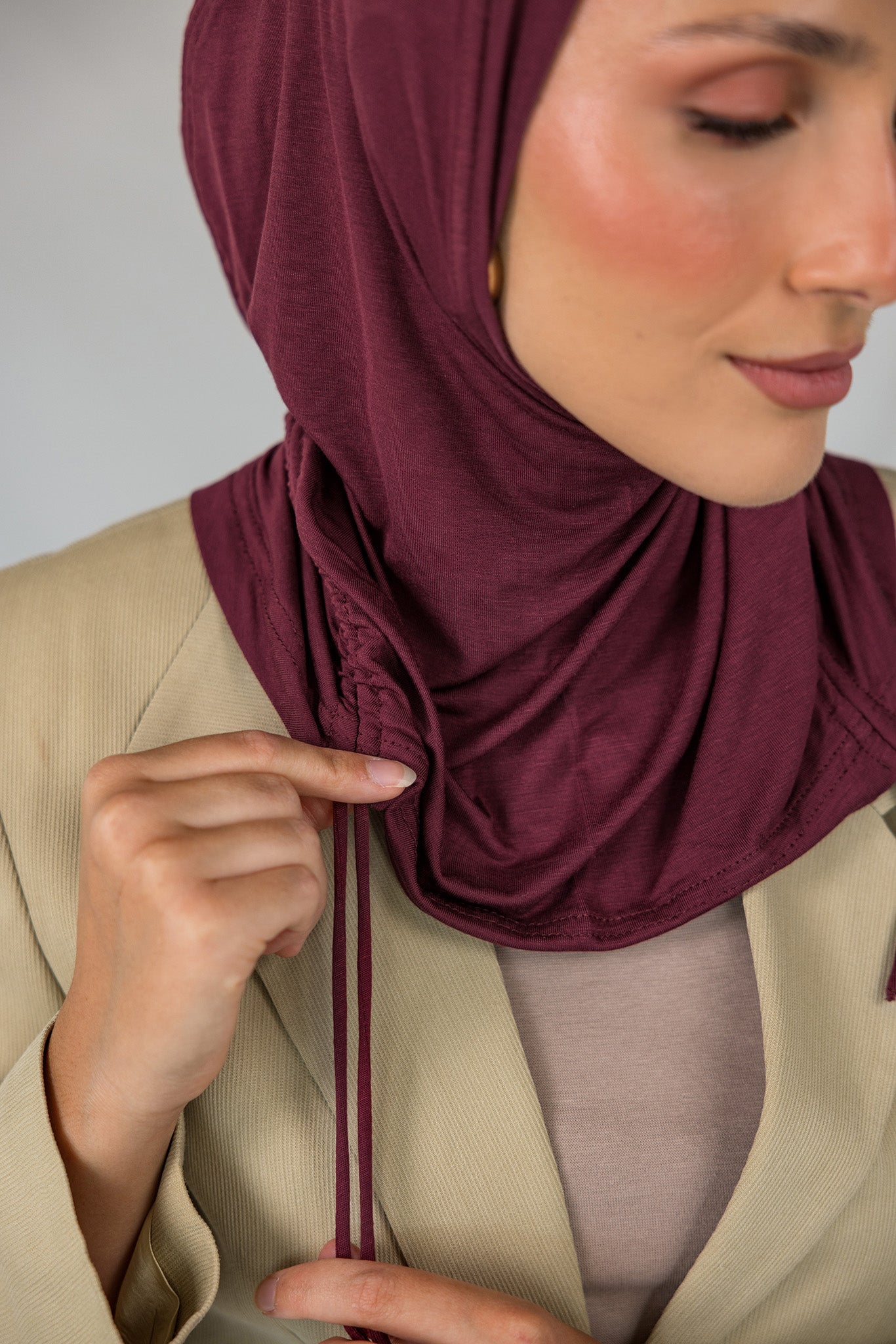 Model wearing Antique Cherry Ruching Lite, featuring ruching at the sides and breathable fabric.