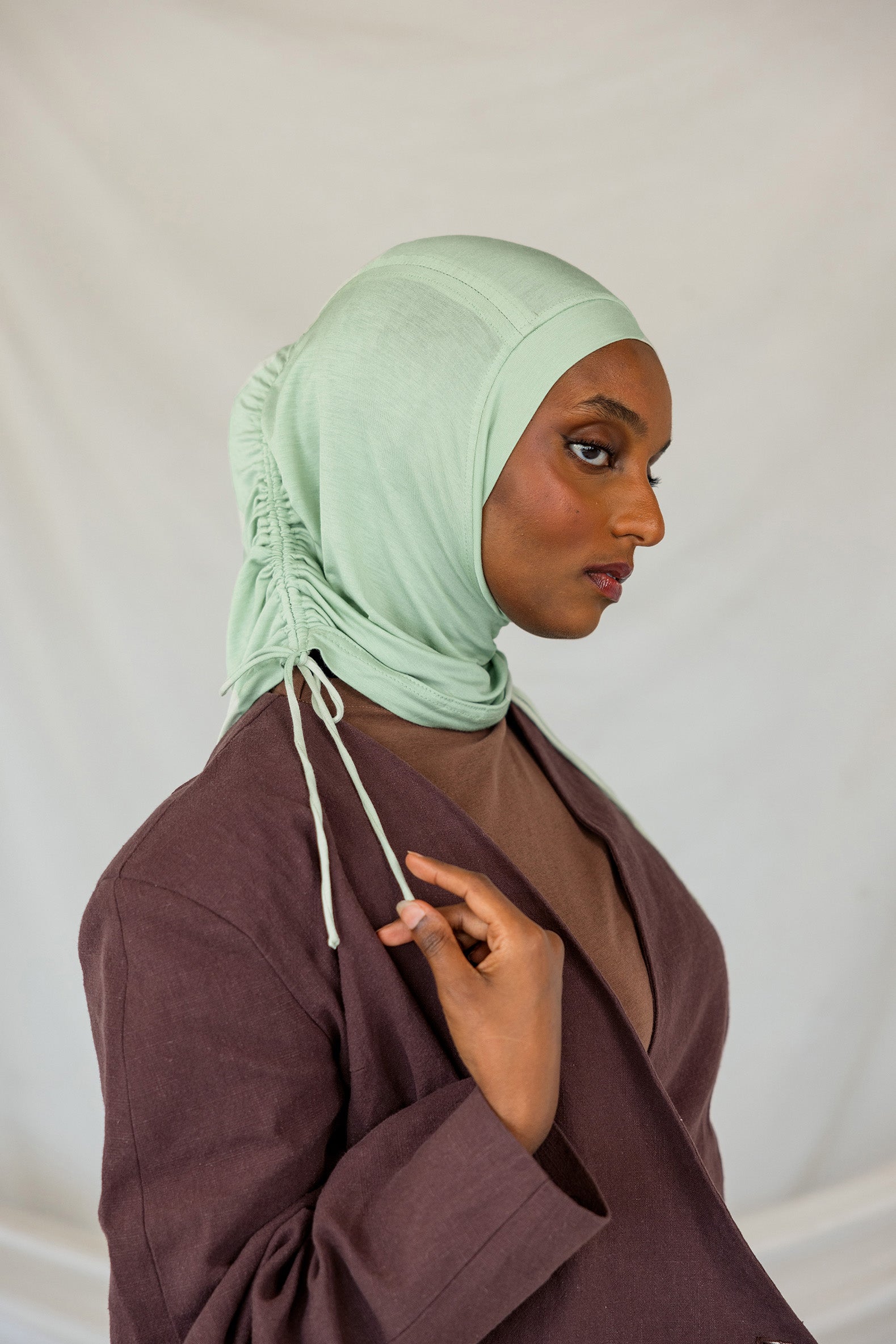 Stylized Sage Mist Ruching Lite hijab depicted on a model.
