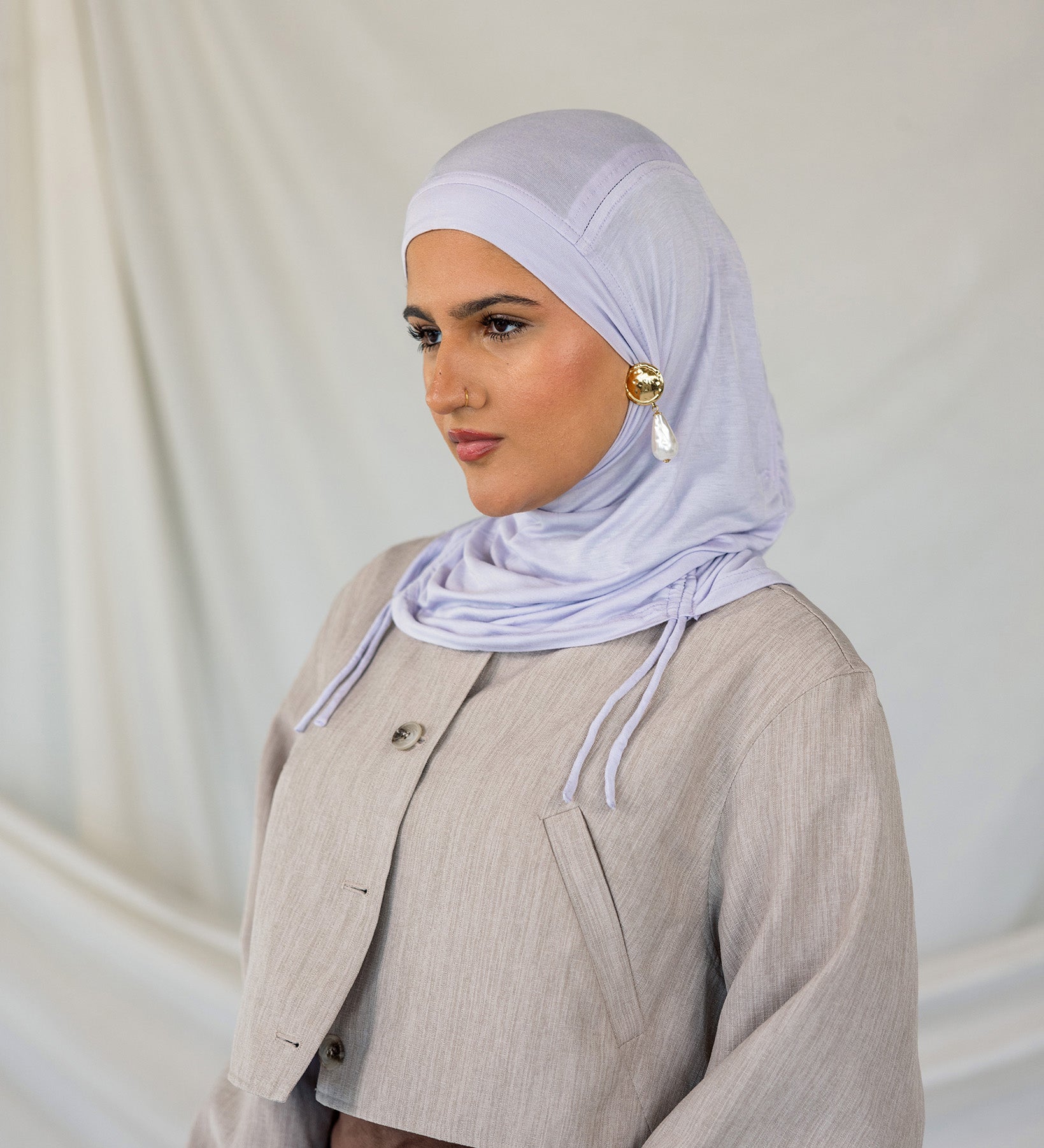 Model wearing Soft Amethyst Ruching Lite, highlighting its delicate ruching and featherlight fabric.