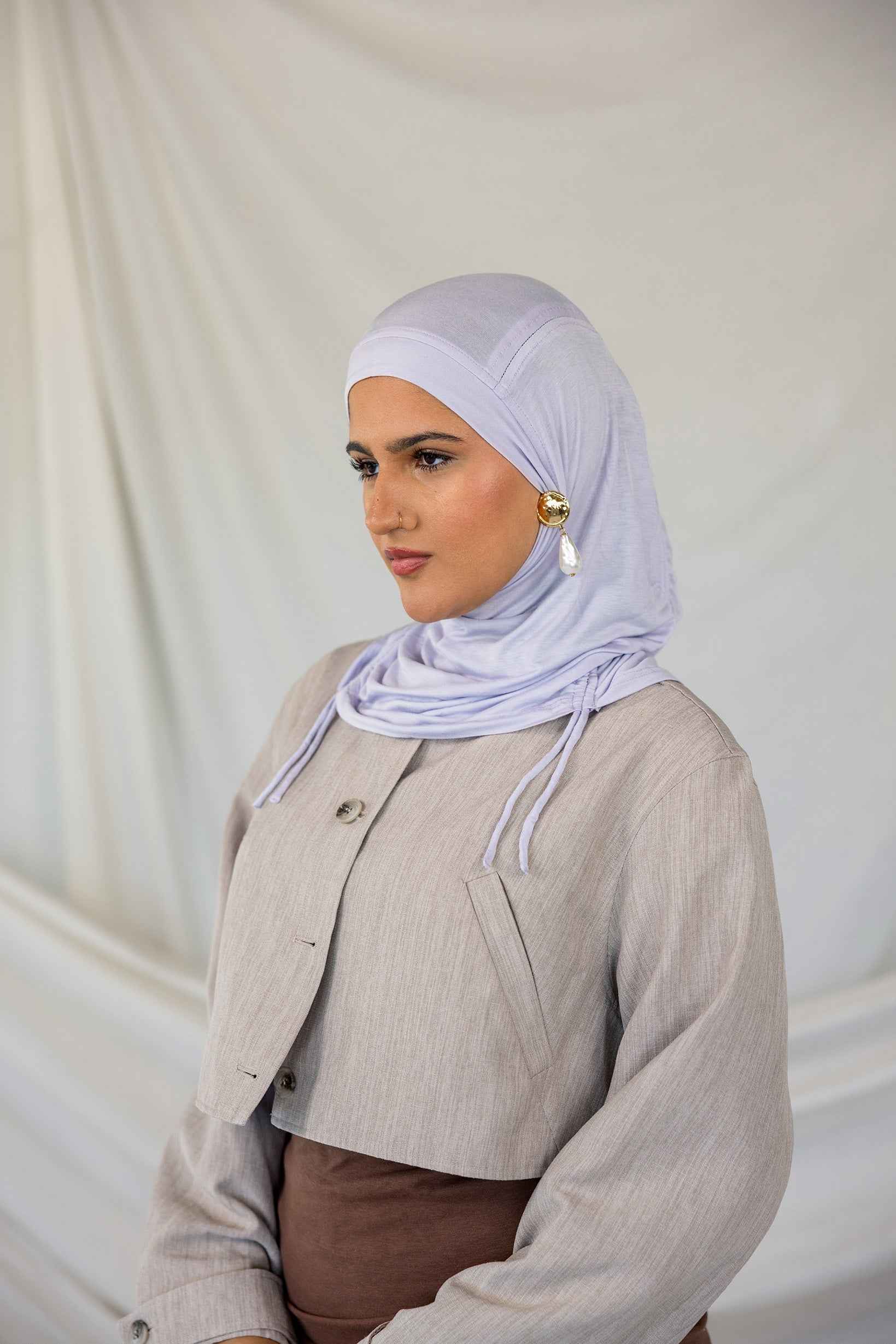 Model wearing Soft Amethyst Ruching Lite, highlighting its delicate ruching and featherlight fabric.