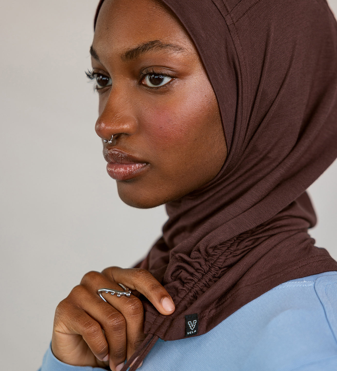 Model wearing Espresso Ruching Lite, highlighting rich brown hue and ruching texture.