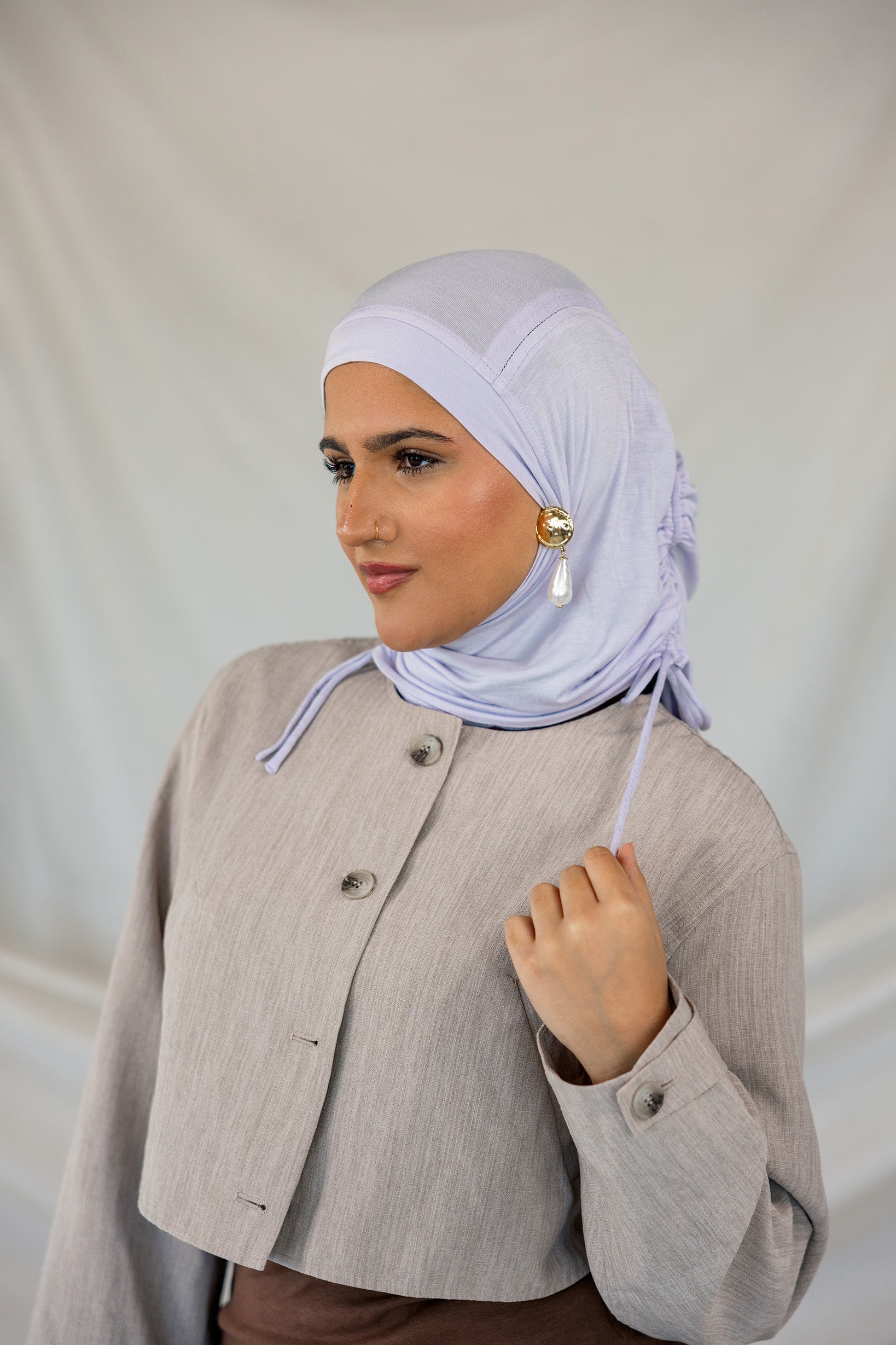 Model wearing Soft Amethyst Ruching Lite showing the soft material.