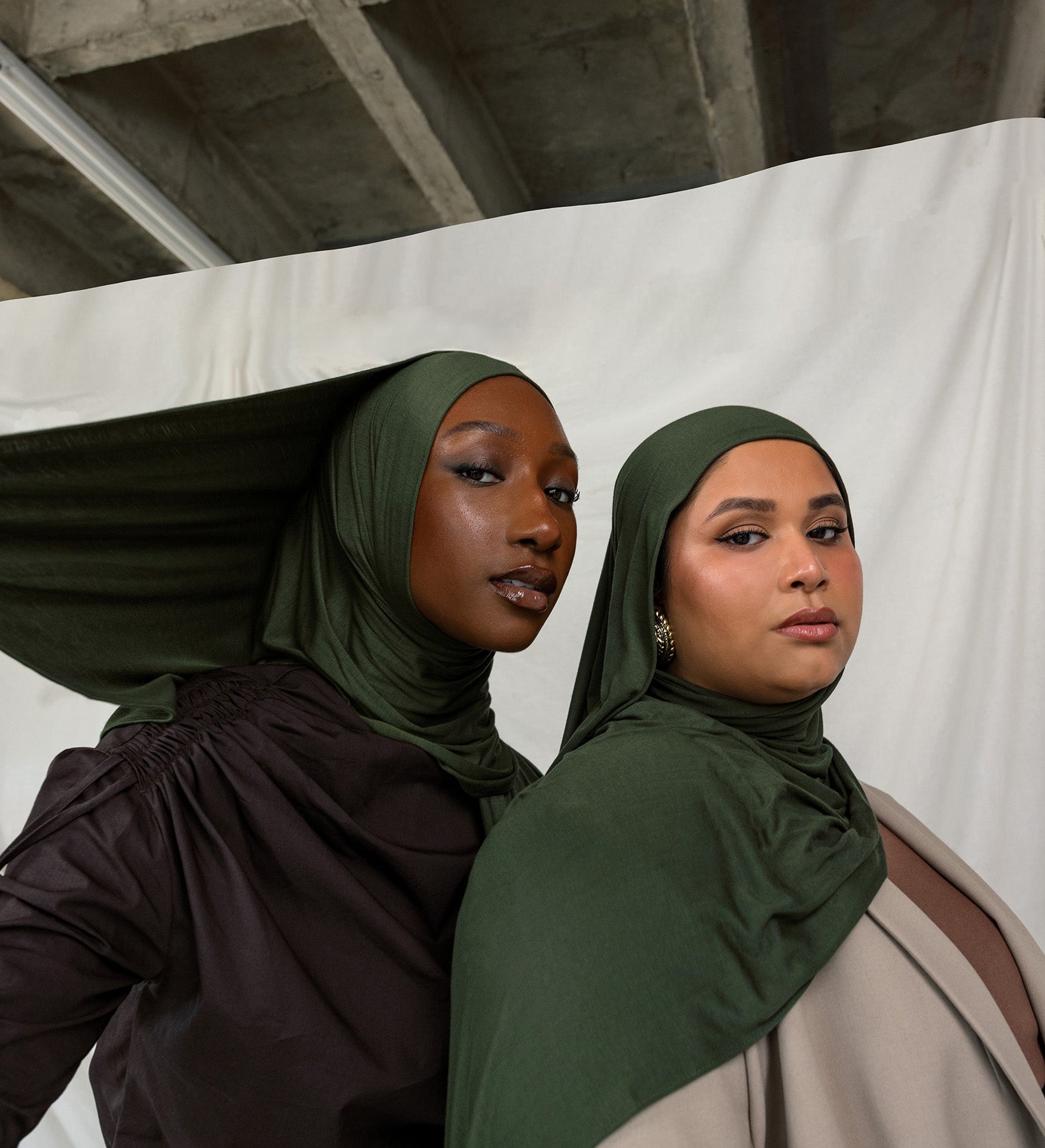 Two models wearing Hunter Green Jersey Lite, both in a front-facing pose, highlighting its deep, rich green color.