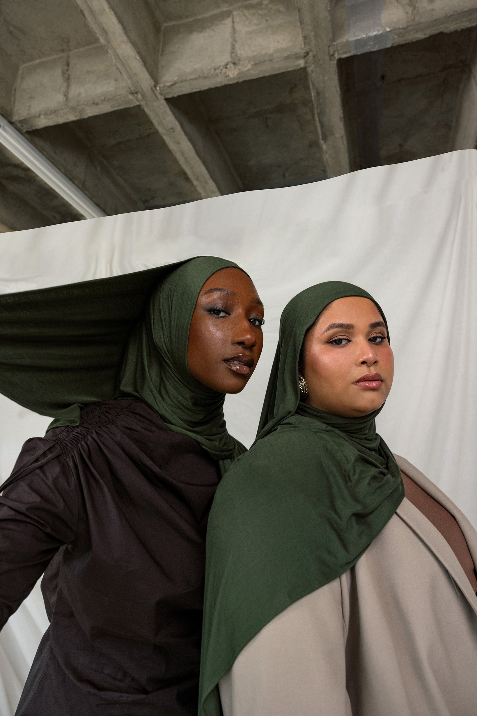 Two models wearing Hunter Green Jersey Lite, both in a front-facing pose, highlighting its deep, rich green color.