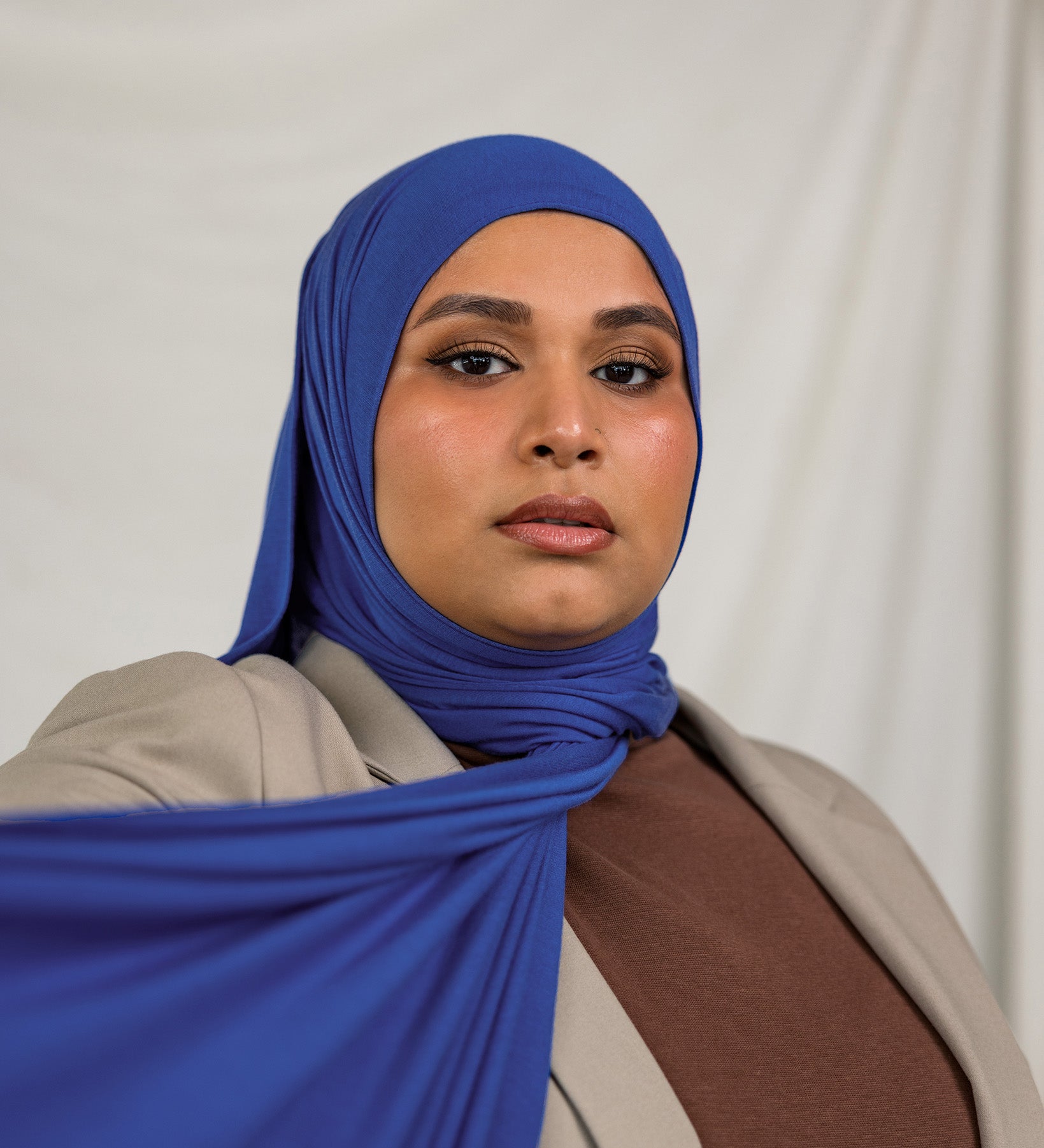 Model wearing Ocean Blue Jersey Lite in a casual wrap style, showing off its breathable, wrinkle-resistant fabric.