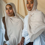 Two Models wearing soft woven hijab with a balanced hue and refined, airy drape