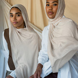 Two Models wearing soft woven hijab with a balanced hue and refined, airy drape