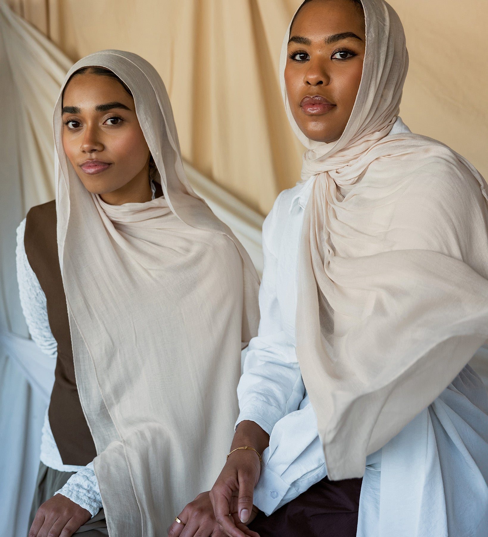 Two Models wearing soft woven hijab with a balanced hue and refined, airy drape