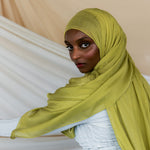 Model wearing lightweight bamboo hijab that adds a bright, refreshing touch to any look.