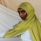 Model wearing lightweight bamboo hijab that adds a bright, refreshing touch to any look.