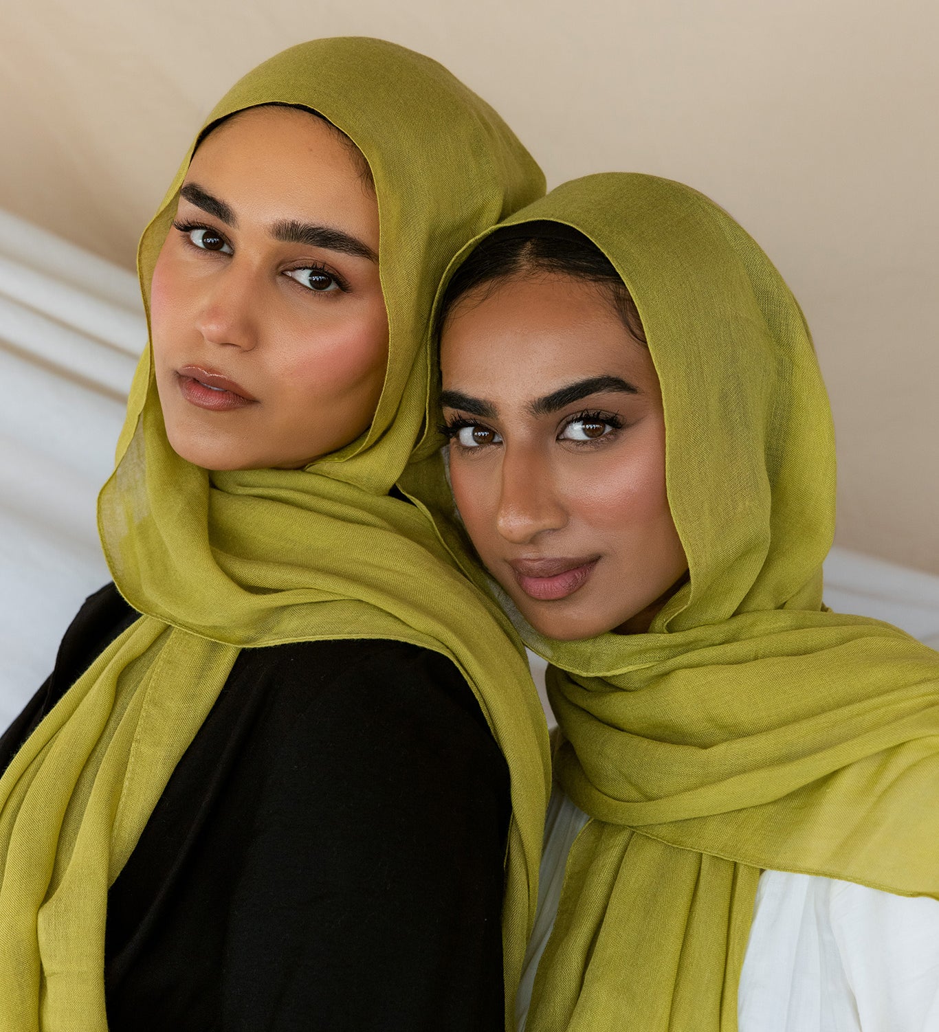 Two Models wearing bamboo hijab with soft texture and vibrant energy, designed for daily wear.