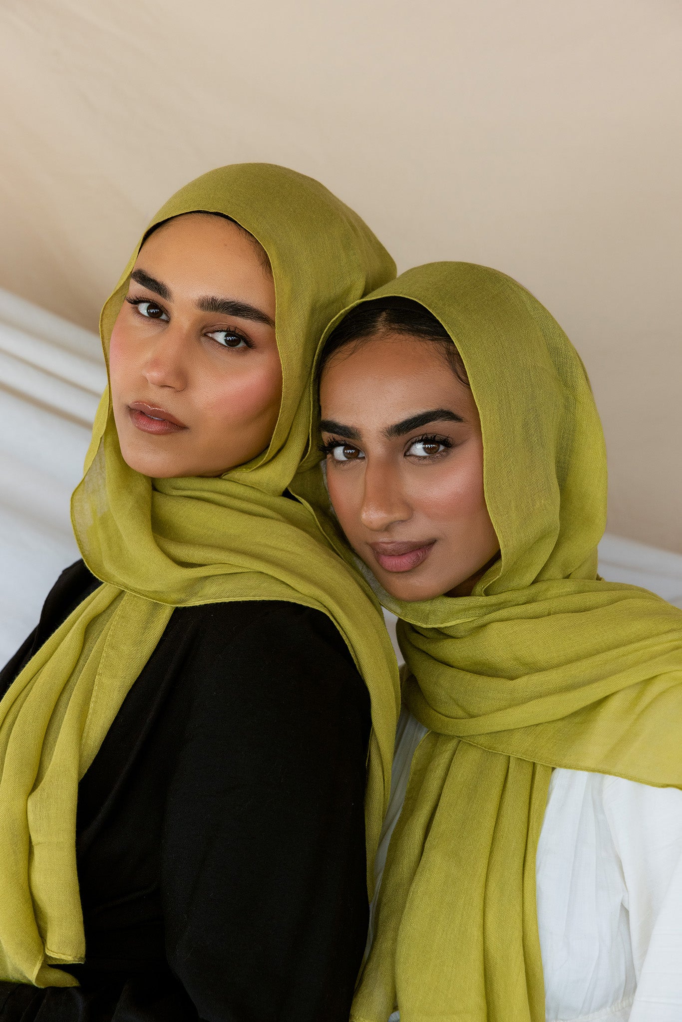 Two Models wearing bamboo hijab with soft texture and vibrant energy, designed for daily wear.