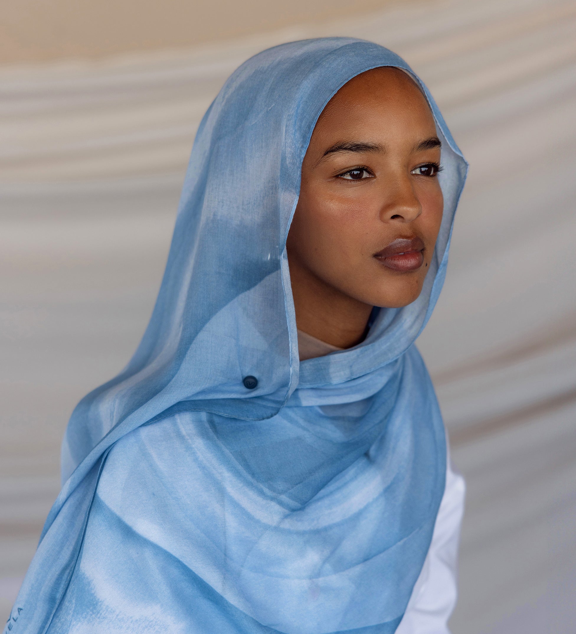 Woven hijab with a smooth, airy texture designed for warm-weather comfort.