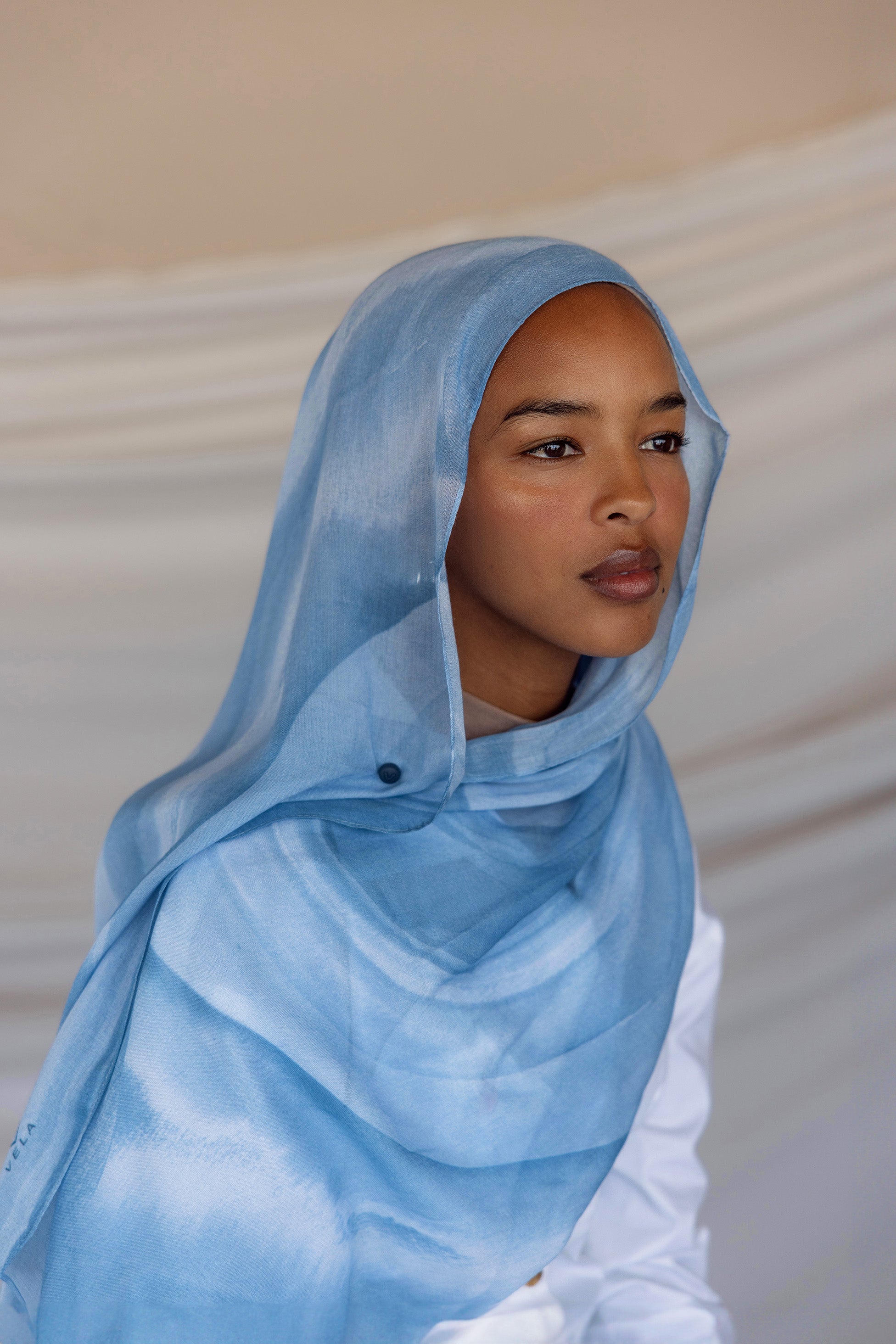 Woven hijab with a smooth, airy texture designed for warm-weather comfort.