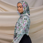 VELA baby blue hijab with small floral print, soft and light for everyday wear.