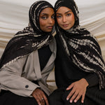 Two Models wearing ripple-textured hijab with flowing pattern and timeless, handmade charm.