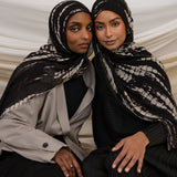 Two Models wearing ripple-textured hijab with flowing pattern and timeless, handmade charm.