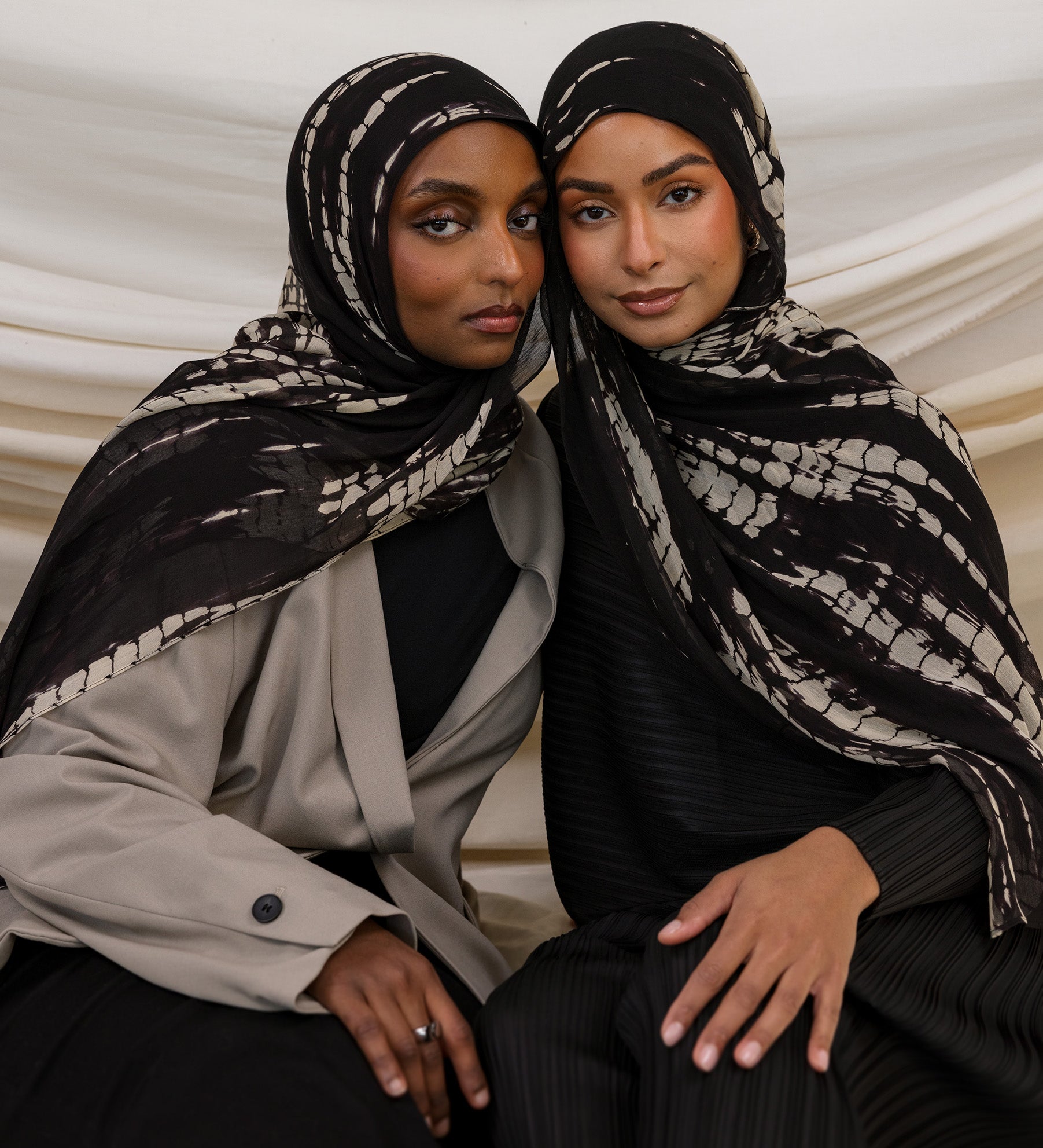 Two Models wearing ripple-textured hijab with flowing pattern and timeless, handmade charm.