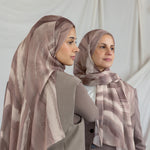Two models wearing brown sediment printed hijabs