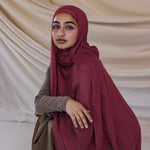 Model wearing modal hijab inspired by earthy spices, crafted for breathable comfort.