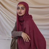 Model wearing modal hijab inspired by earthy spices, crafted for breathable comfort.
