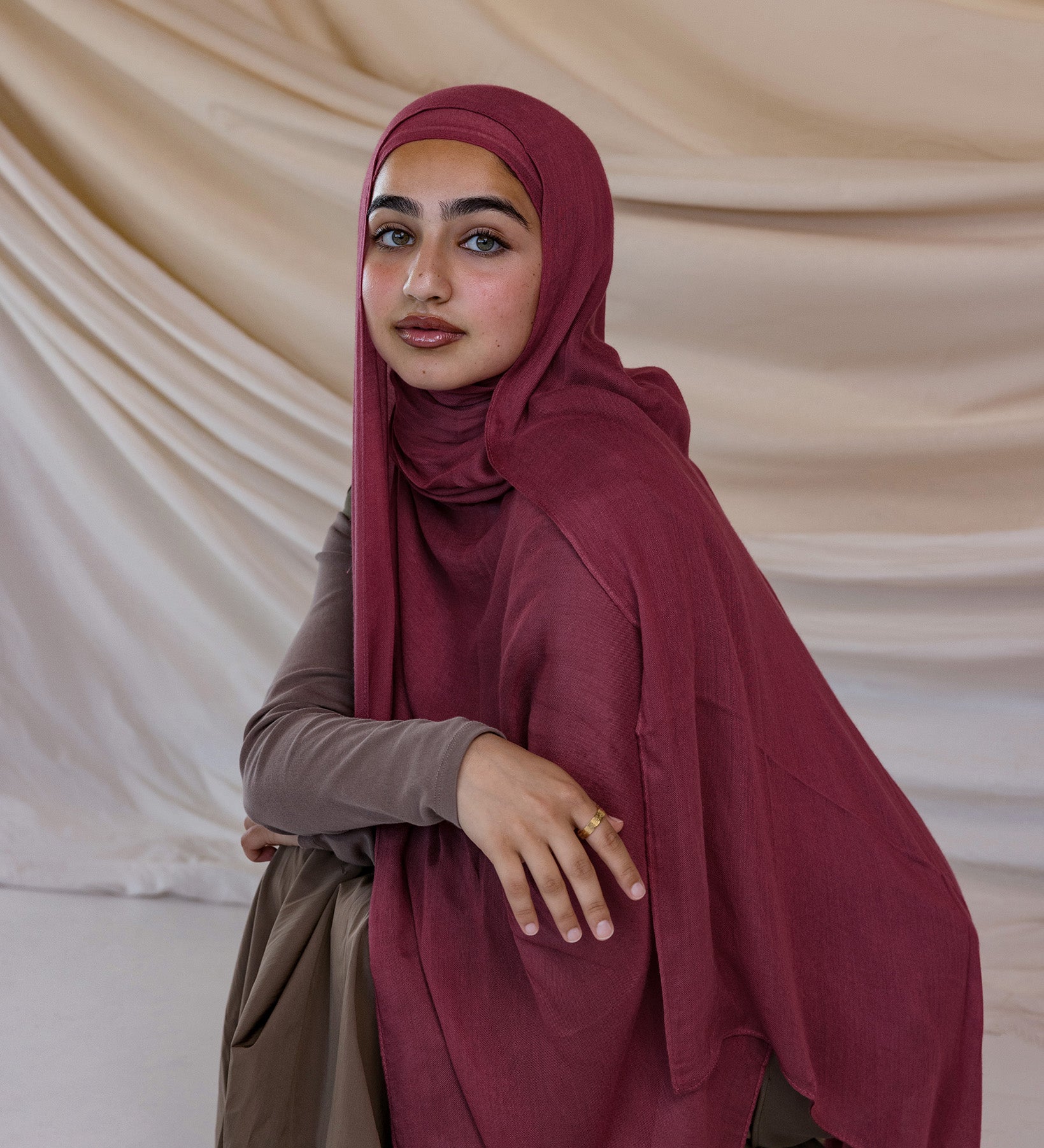 Model wearing modal hijab inspired by earthy spices, crafted for breathable comfort.