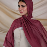Model wearing lightweight modal hijab with a rich, tart spice-inspired finish.