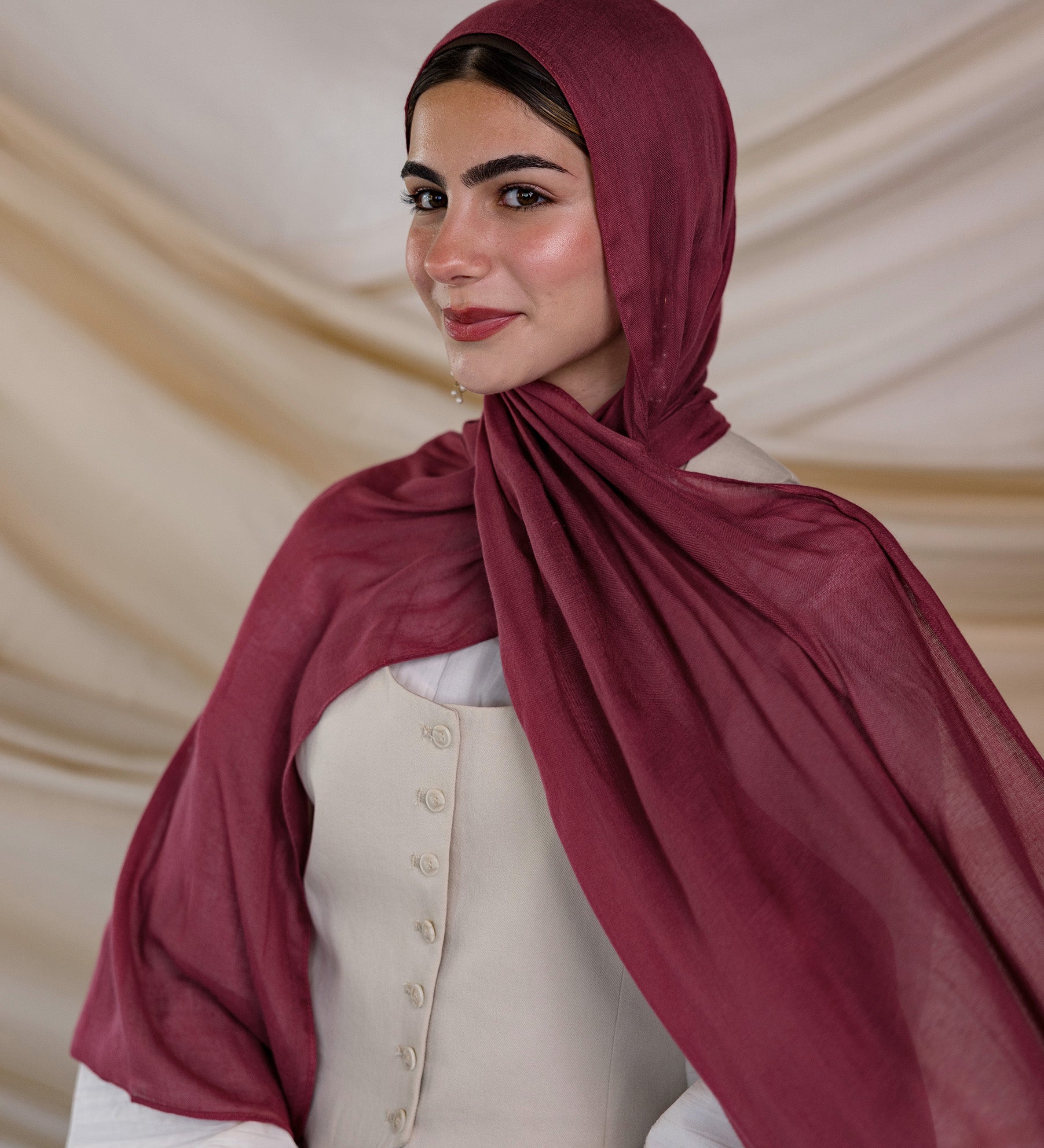 Model wearing lightweight modal hijab with a rich, tart spice-inspired finish.