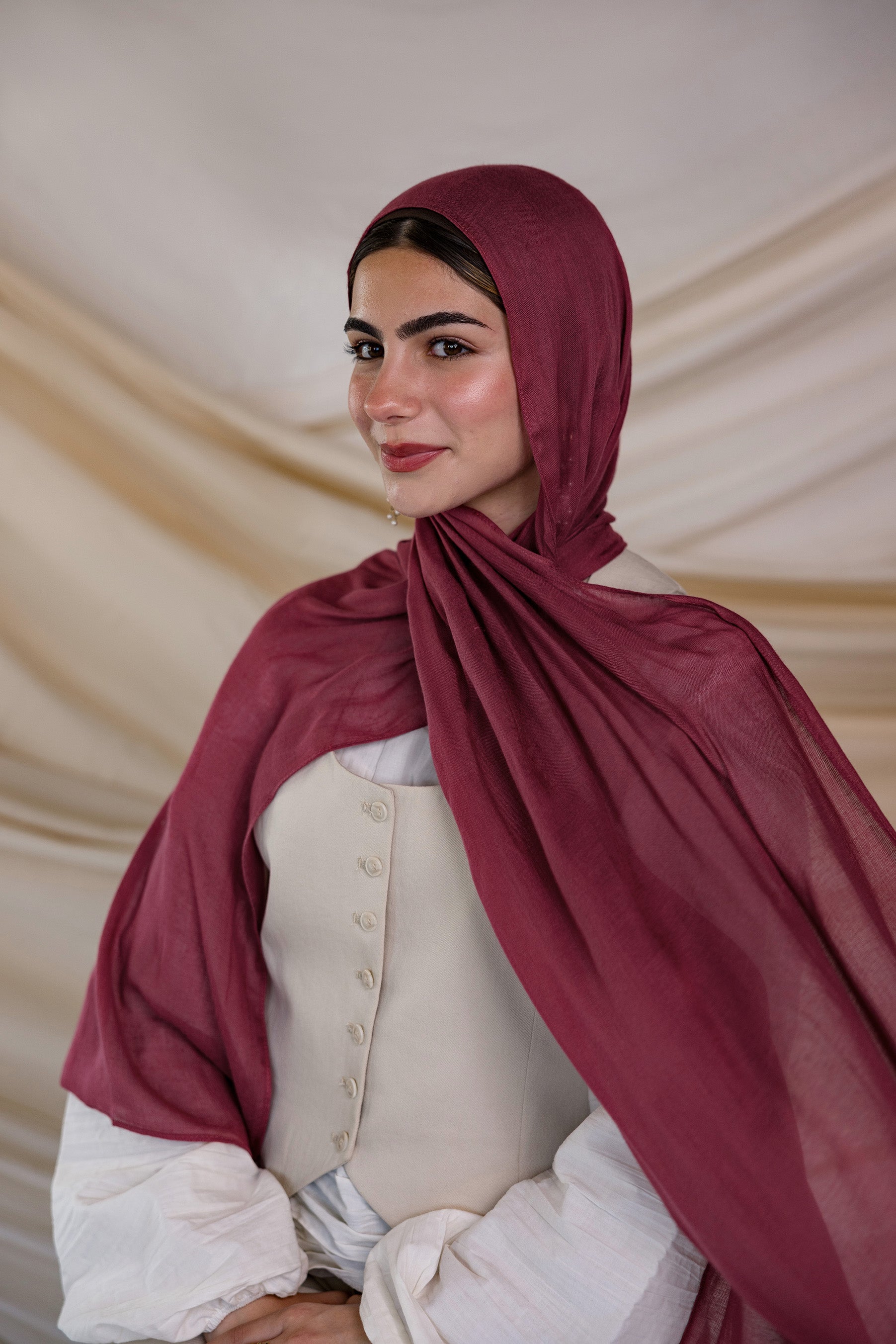 Model wearing lightweight modal hijab with a rich, tart spice-inspired finish.