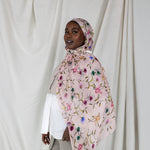 Model wearing ethically made hijab with a charming floral motif and effortless drape.