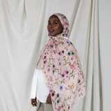 Model wearing ethically made hijab with a charming floral motif and effortless drape.
