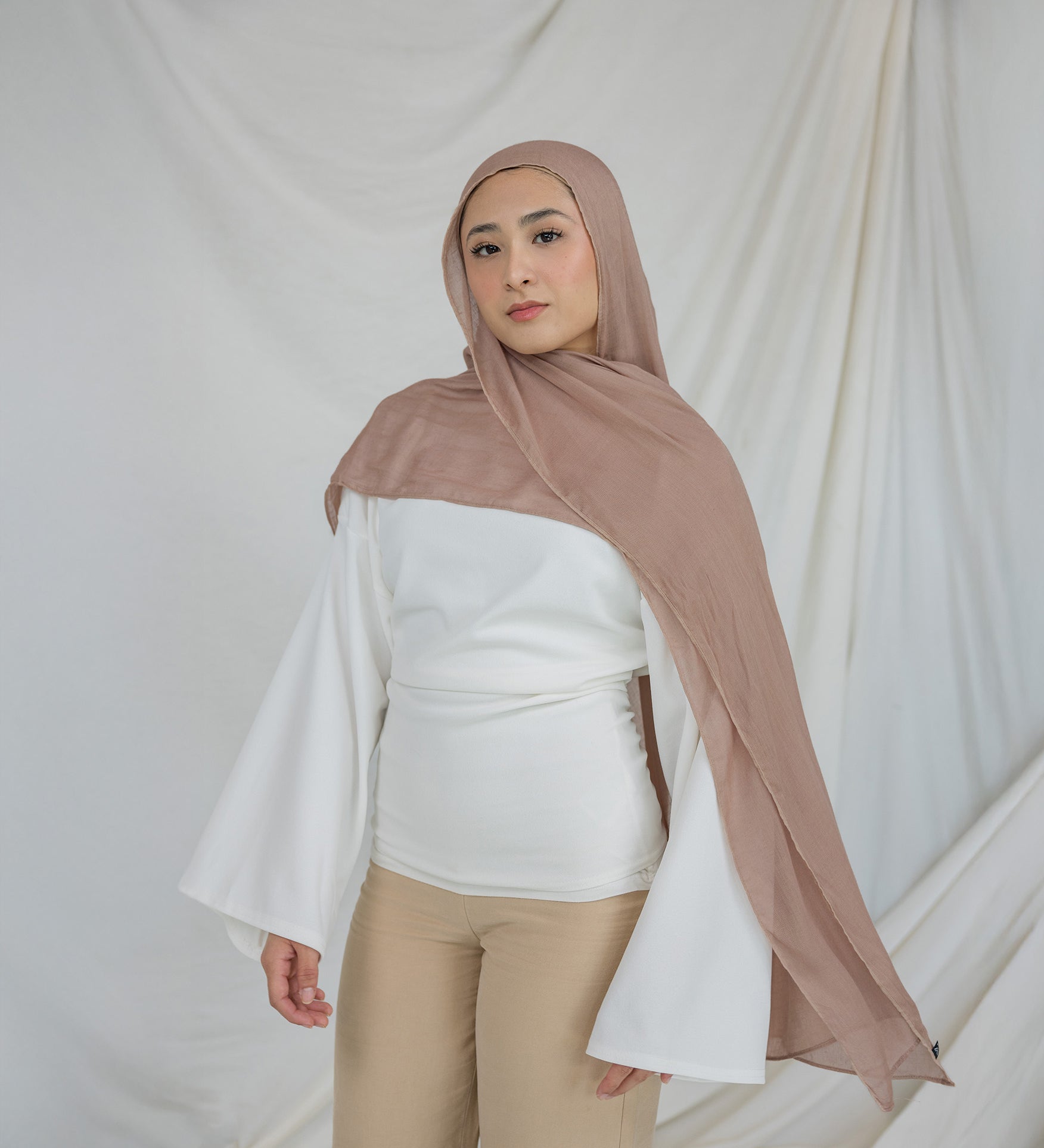Light Taupe modal hijab with warm undertones that go with both soft and bold colors.