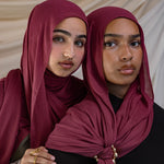 Two Models wearing hand-dyed modal hijab featuring warm, nature-rooted tones.