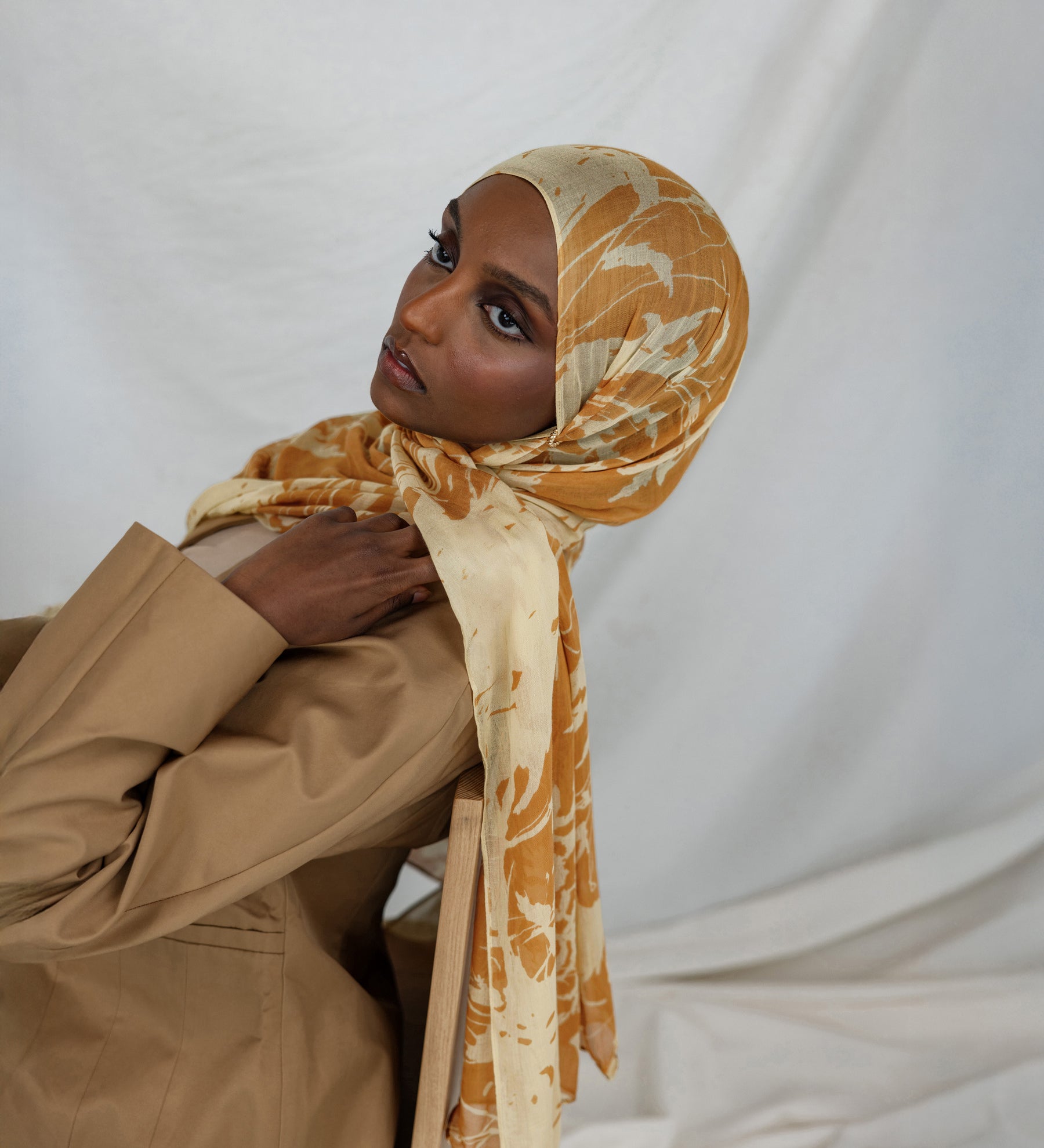Model wearing modal hijab with tonal botanical print and a soft, natural finish.