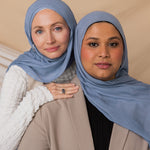Two models wearing Serenity Blue hijab against a backdrop.