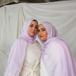 Two Models wearing hand-dyed modal hijab with a soft violet tone and airy texture