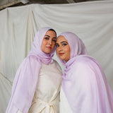 Two Models wearing hand-dyed modal hijab with a soft violet tone and airy texture