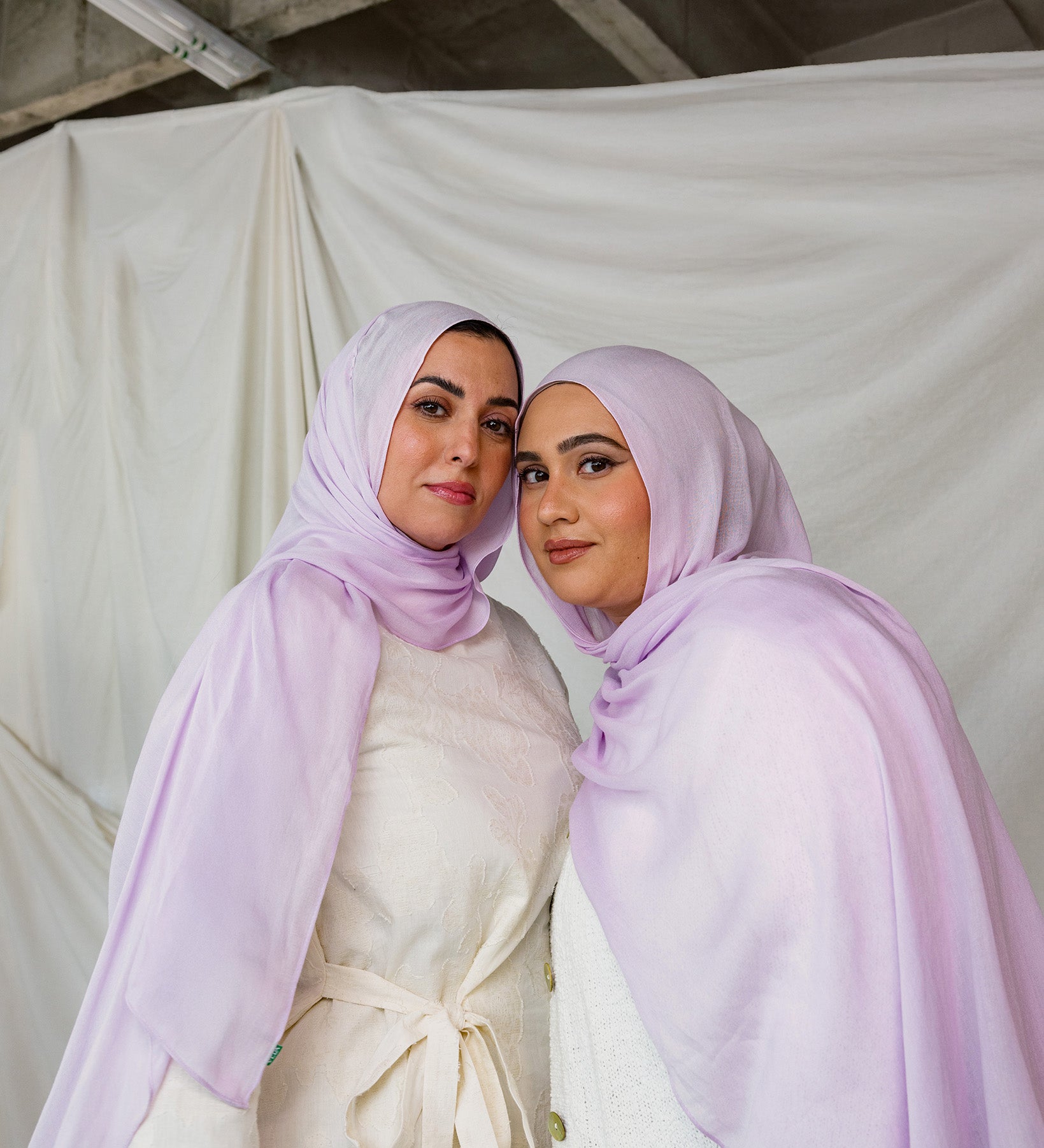 Two Models wearing hand-dyed modal hijab with a soft violet tone and airy texture