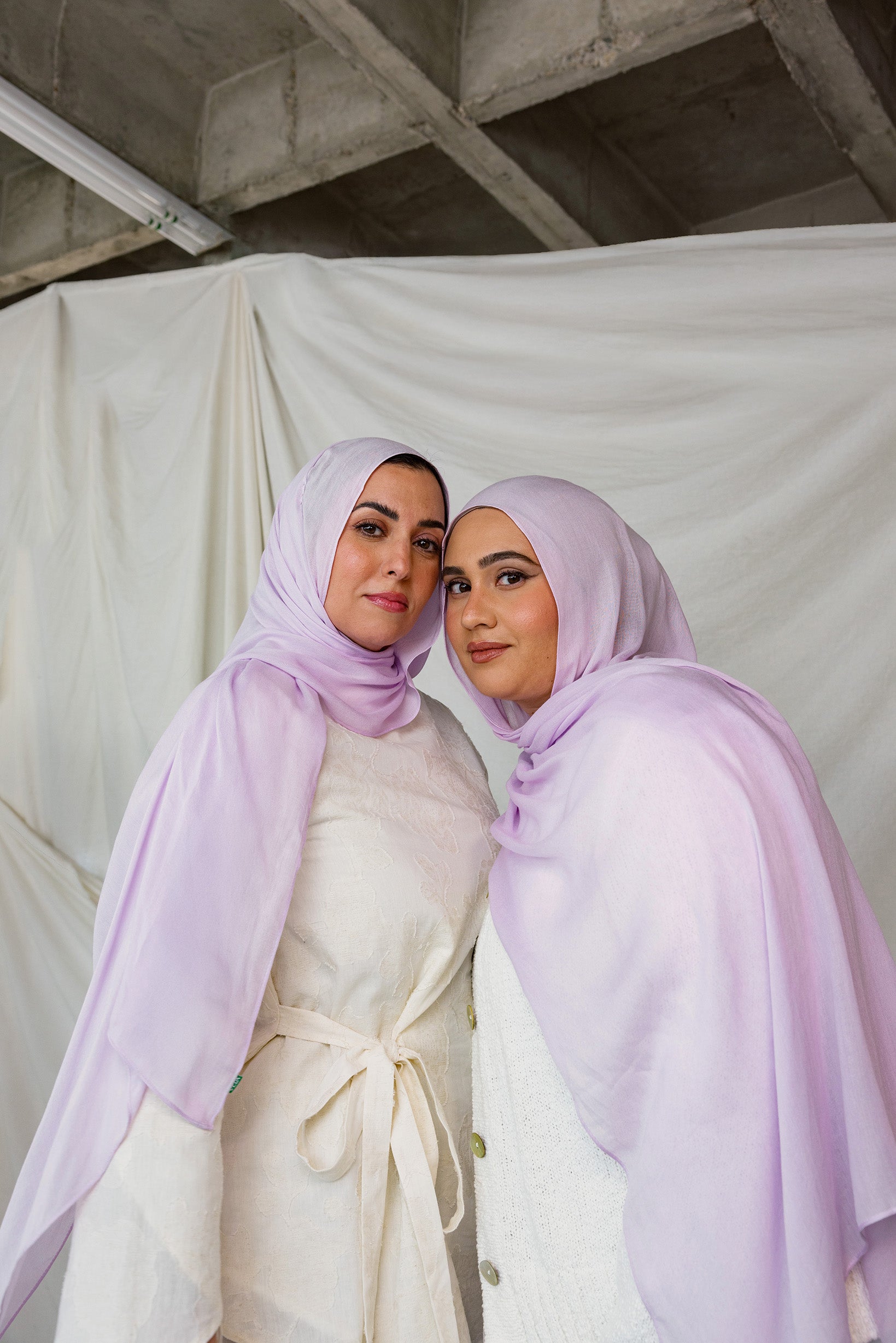Two Models wearing hand-dyed modal hijab with a soft violet tone and airy texture