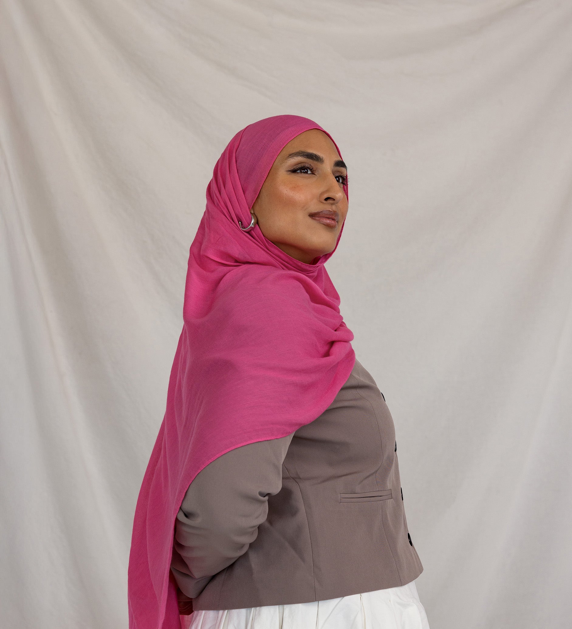 Model shown wearing Rose Wave, a bright and saturated pink scarf.