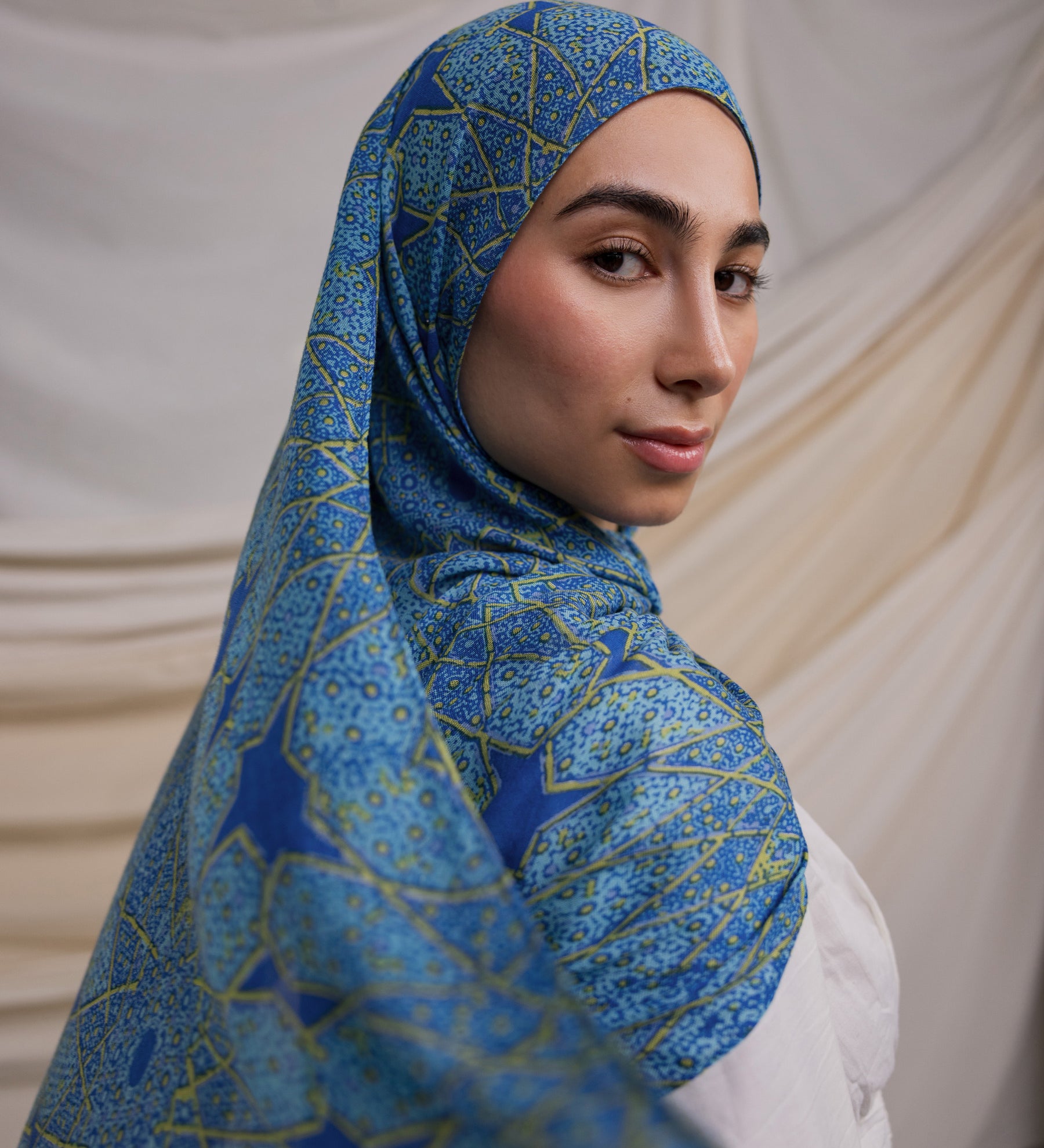 Instant hijab featuring hand-printed Islamic patterns inspired by Afghan architecture.